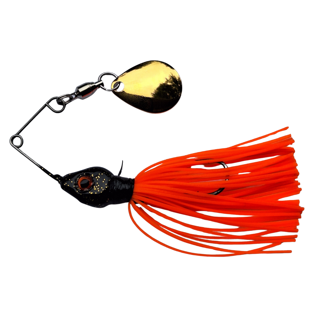 Fishing lure with orange skirt and gold and black details on a white background